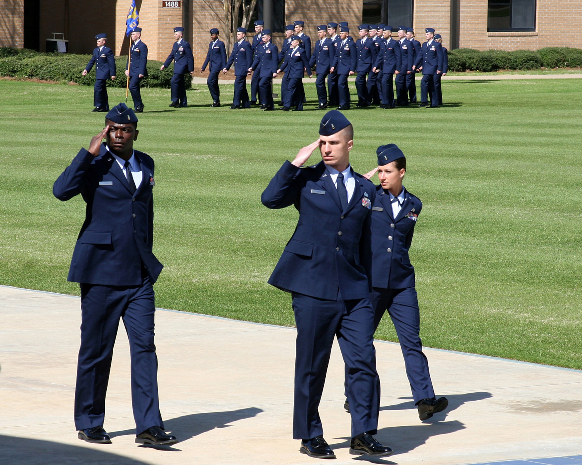 2nd Lt. Nick Reinke (center), a pilot trainee in the Kentucky Air National Guard's 165th Airlift Squadron, salutes the commandant of the Academy of Military Science during a graduation parade March 3, 2011, for newly commissioned Air Force officers at Maxwell Air Force Base, Ala. Lieutenant Reinke was named Distinguished Graduate of his class and was selected by his peers to serve as Officer Candidate Wing Commander. He is slated to begin Undergraduate Pilot Training at Columbus Air Force Base, Miss., this summer. (Courtesy photo)