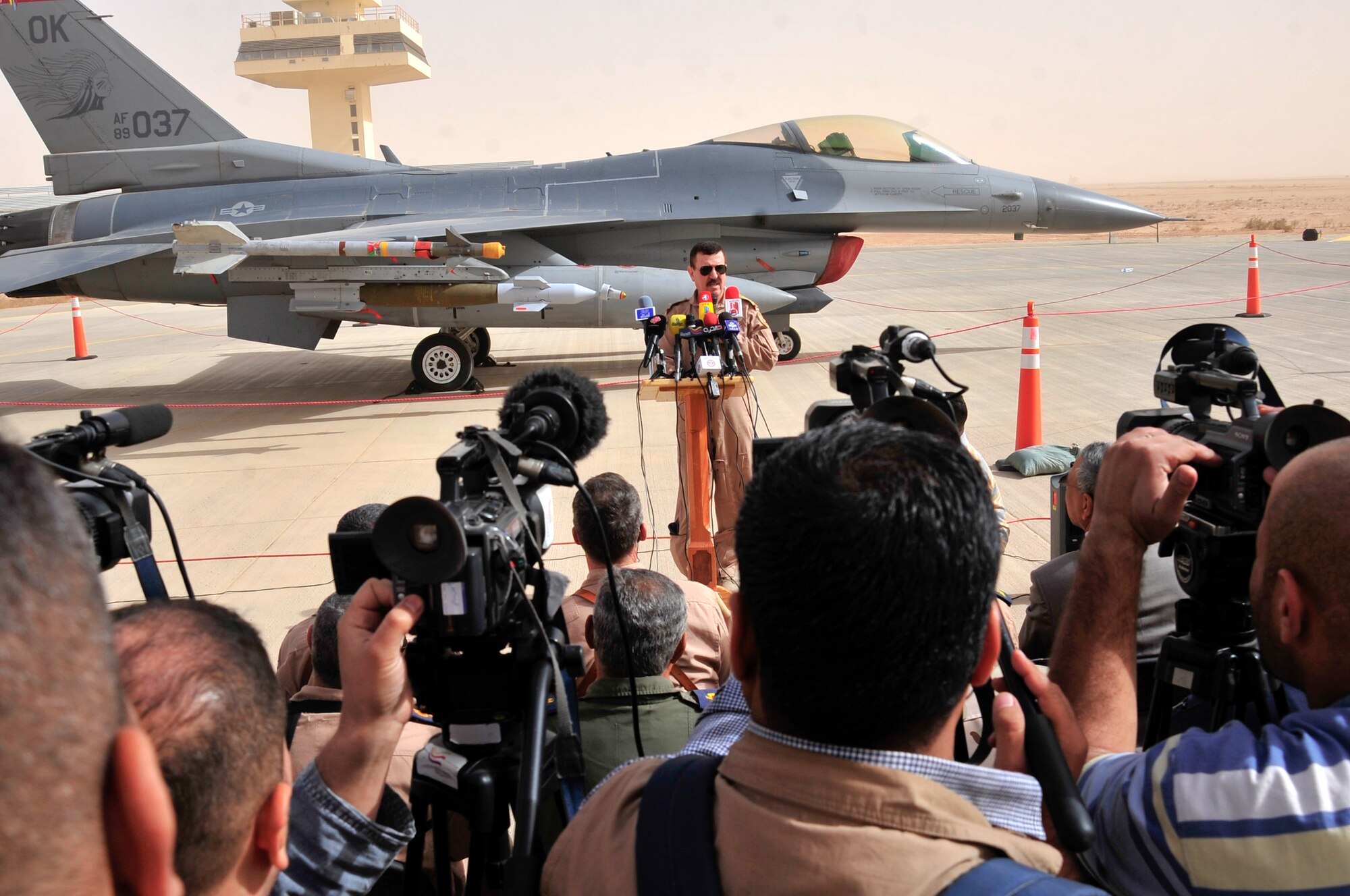 Staff Lt. Gen. Anwer Amin, the commander of the Iraqi air force, hosts a press conference in Western Iraq Nov. 8, 2011. He told the Iraqi and Pan-Arab media Iraq's purchase of 18 F-16C Fighting Falcons, for their future air defense, will encourage and strengthen the strategic partnership between the U.S. and Iraq. Amin conducted the press conference in front of an F-16 static display provided by the 125th Expeditionary Fighter Squadron, an Oklahoma Air National Guard unit providing top cover in Iraq for U.S. service members. When the Iraqi F-16s are delivered, most likely sometime in late 2014 or 2015, Iraq will have the most advanced multi-role fighter aircraft in the world. (U.S. Air Force photo/Master Sgt. Cecilio Ricardo)