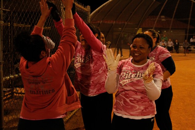 Where My Pitches? players rejoice as they tie up the game with S.W.A.T. in the seventh inning, 7-7, during the All-Women’s Softball League Championship game Nov. 21, 2011 at Felix Field. Where My Pitches? took the game in the extra inning.::r::::n::