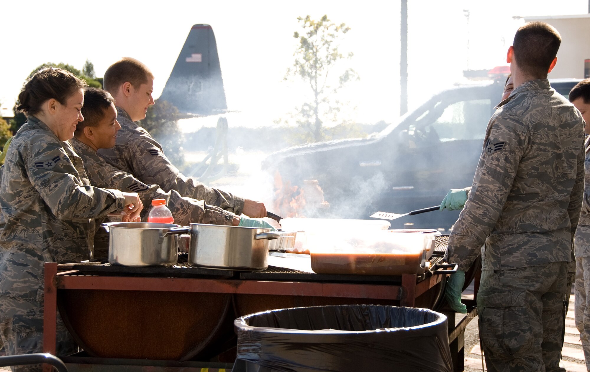 YOKOTA AIR BASE, Japan -- Airmen prepare food for a luncheon during a spouse day event at Yokota Air Base, Japan, Nov. 16, 2011. The event included lunch, static aircraft displays and briefings about the aircraft. (U.S. Air Force photo/Airman 1st Class Krystal M. Garrett)  