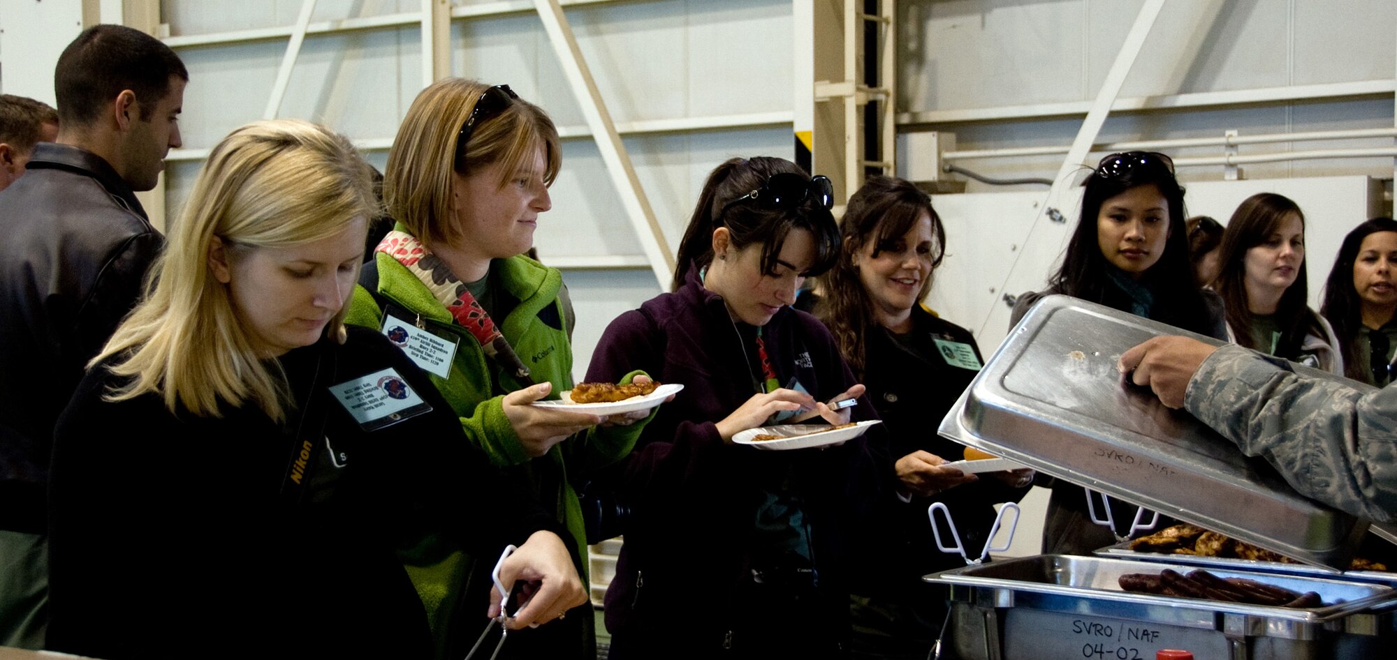 YOKOTA AIR BASE, Japan -- Spouses have lunch during a spouse day event at Yokota Air Base, Japan, Nov. 16, 2011. The event included lunch, static aircraft displays and briefings about the aircraft. (U.S. Air Force photo/Airman 1st Class Krystal M. Garrett)  