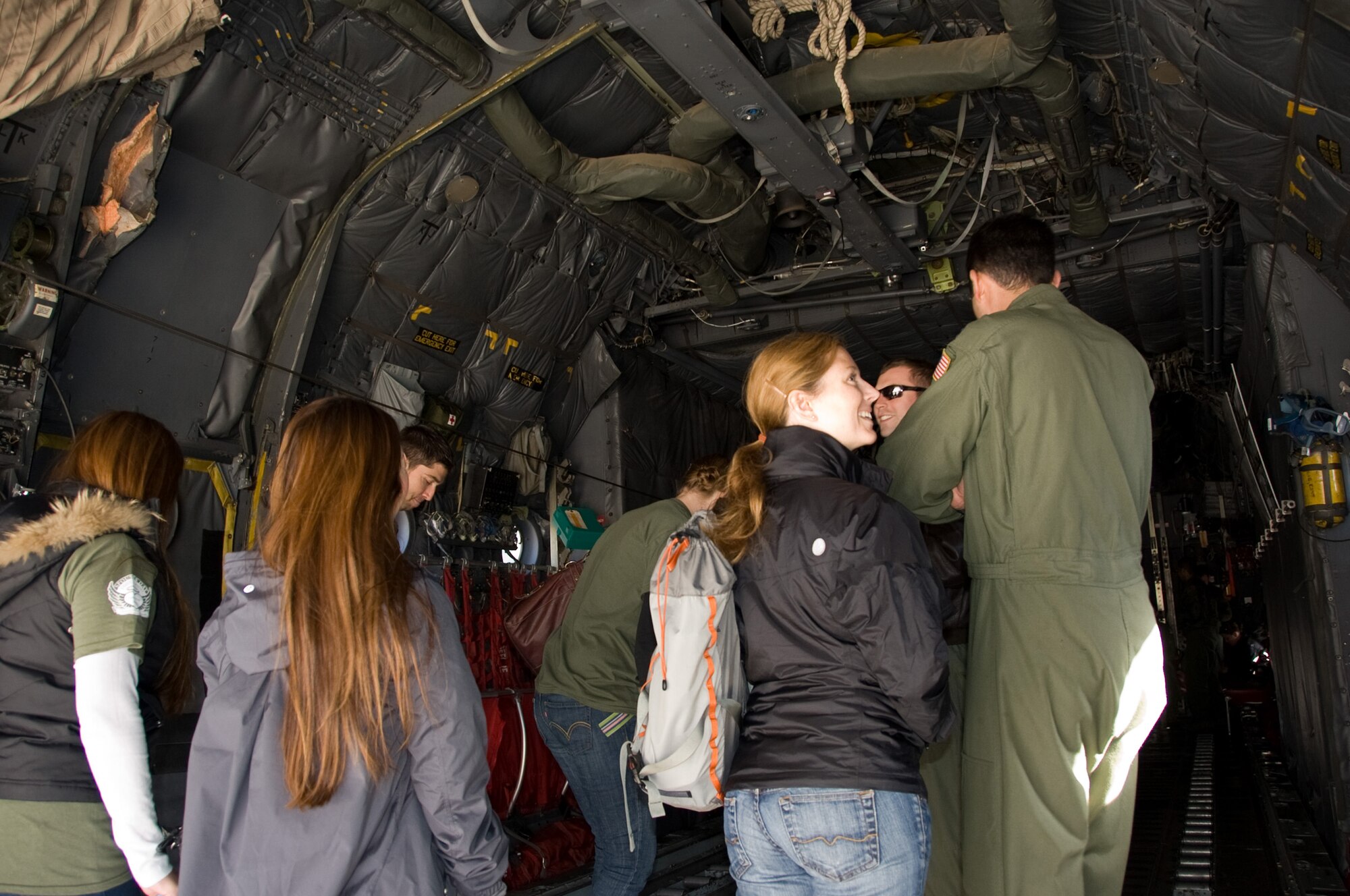 YOKOTA AIR BASE, Japan -- Pilots give spouses a tour of a C-130 Hercules during a spouse day event at Yokota Air Base, Japan, Nov. 16, 2011. The event included static aircraft displays, briefings about the aircraft and lunch. (U.S. Air Force photo/Airman 1st Class Krystal M. Garrett)  
  
