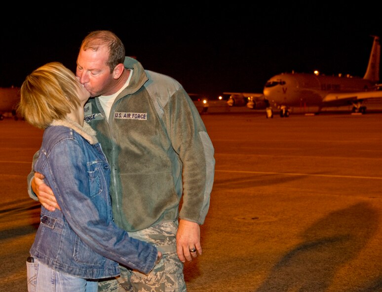 U.S. Air Force Staff Sgt. David Prince, 116th Air Control crew chief, receives a long awaited kiss from his wife, Senior Airman Marcelline Prince upon his 
return from deployment supporting operations in Libya, Robins Air Force Base, Ga., Nov. 5, 2011. Prince is a part of the combined U.S. Air Force 116th and 
461st ACW and U.S. Army 138th Military Intelligence Company, flying the E-8 Joint STARS aircraft, which deployed more than 300 members on short notice in 
March to support Operations Odyssey Dawn and Unified Protector off the coast of Libya.  The deployers arrived late Saturday evening and were greeted by 
friends and family as they stepped off the jet. 
(National Guard photo by Master Sgt. Roger Parsons/Released)