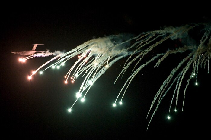 A U.S. Air Force C-17 Globemaster III performs evasive countermeasures by launching flares during a Mobility Air Forces Exercise Nov. 16, over the Nevada Test and Training Range. The U.S. Air Force Weapons School holds MAFEX twice a year to test the ability of C-17A Globemaster III and C-130 Hercules aircrews from Air Force bases around the world to join together in a formation at a specific time and location to insert ground forces anywhere in the world. The 820th RED HORSE Airborne Flight conducted airdrops over the NTTR. (U.S. Air Force photo by Senior Airman Brett Clashman/Released)