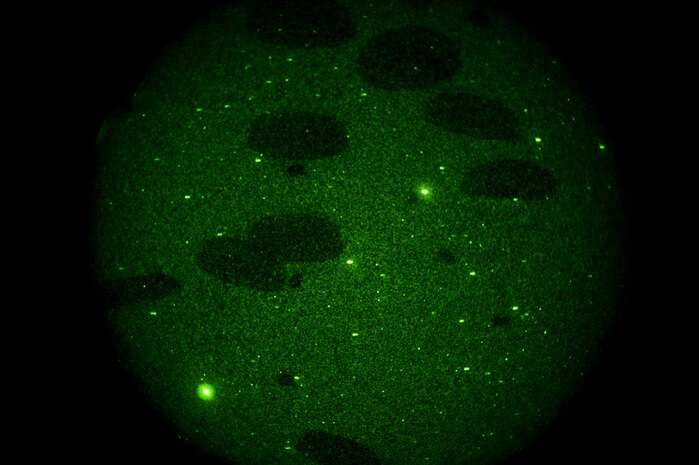 A U.S. Air Force C-17 Globemaster III drops cargo during the Mobility Air Forces Exercise Nov. 16, over the Nevada Test and Training Range. The U.S. Air Force Weapons School holds MAFEX twice a year to test the ability of C-17 Globemaster and C-130 Hercules aircrews from Air Force bases around the world to join together in a formation at a specific time and location to insert ground forces anywhere in the world. The 820th RED HORSE Airborne Flight conducted airdrops over the NTTR.(U.S. Air Force photo by Airman 1st Class Daniel Hughes/Released)