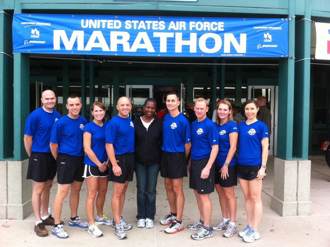 Eight members of Air Mobility Command's Air Force Marathon Team are pictured before participating in the Air Force Marathon on Sept. 15, 2011, at Wright-Patterson AFB, Ohio. Pictured are (left to right): Tech. Sgt. Keith Eberhardt, Staff Sgt. Robert Gant, Chief Master Sgt. Tami Spellman, Mr. Ken Sorg, Master Sgt. Shannon Midgette (team coordinator), Capt. David Bereda, Master Sgt. Scott Bridgeman, Capt. Shawn McGregor and Capt. Sarah Thomas. This AMC-sponsored team resulted in four Boston Marathon qualifiers: Thomas, Bereda, Bridgeman and Spellman, all from Scott AFB. (Courtesy Photo)