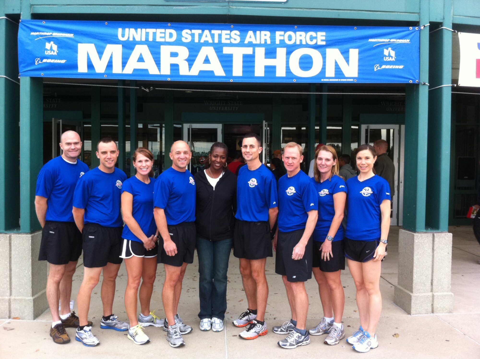 Eight members of Air Mobility Command's Air Force Marathon Team are pictured before participating in the Air Force Marathon on Sept. 15, 2011, at Wright-Patterson AFB, Ohio. Pictured are (left to right): Tech. Sgt. Keith Eberhardt, Staff Sgt. Robert Gant, Chief Master Sgt. Tami Spellman, Mr. Ken Sorg, Master Sgt. Shannon Midgette (team coordinator), Capt. David Bereda, Master Sgt. Scott Bridgeman, Capt. Shawn McGregor and Capt. Sarah Thomas. This AMC-sponsored team resulted in four Boston Marathon qualifiers: Thomas, Bereda, Bridgeman and Spellman, all from Scott AFB. (Courtesy Photo)