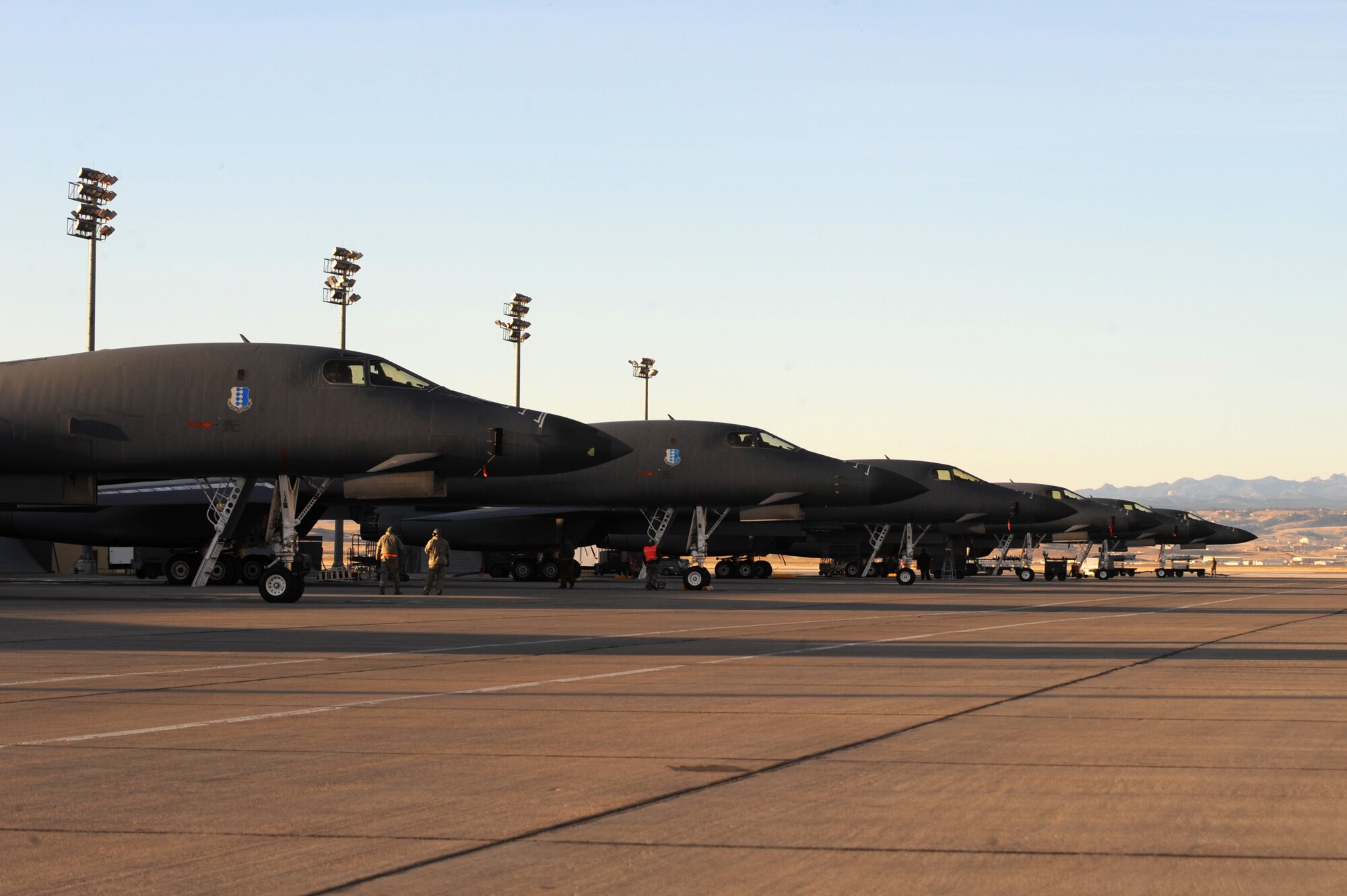 B-1B Lancers sit on the flightline in preparation for an operations surge at Ellsworth Air Force Base, S.D., Nov. 17, 2011. The training opportunity tested the combat readiness and effectiveness of the B-1B Lancer, which can rapidly deliver massive quantities of precision and non-precision weapons against any adversary, anywhere in the world. (U.S. Air Force photo by Senior Airman Kasey Close/Released)