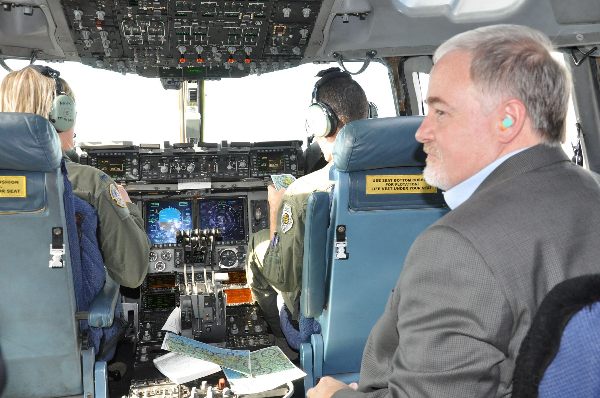 WRIGHT-PATTERSON AIR FORCE BASE, Ohio – Steve Hill, Chief of Staff, Oklahoma City Mayor, enjoys the view of the Michigan landscape from the flight deck of a 445th Airlift Wing C-17 Globemaster III during an orientation flight Nov. 17. Hill, who was representing Tinker Air Force Base, Okla., and 20 other Air Force Materiel Command Community Liaison Program members representing various AFMC bases were on the flight as part of their visit to the 445th Airlift Wing. (U.S. Air Force photo/Stacy Vaughn)