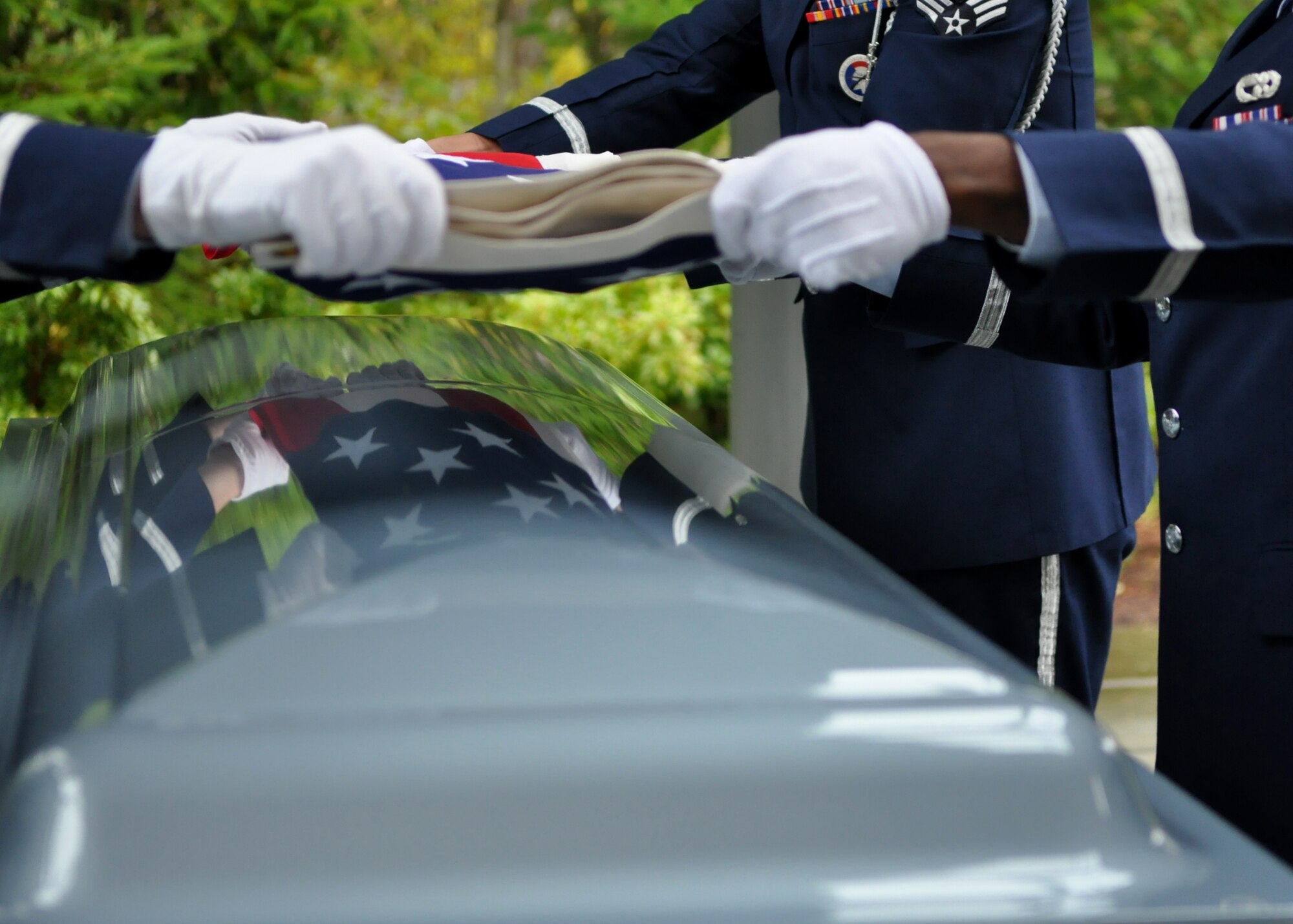 Airmen assigned to the McChord Field Honor Guard fold the American Flag during a funeral Nov. 18, 2011, at Tahoma National Cemetery in Kent, Wash. (U.S. Air Force photo/Airman 1st Class Leah Young)