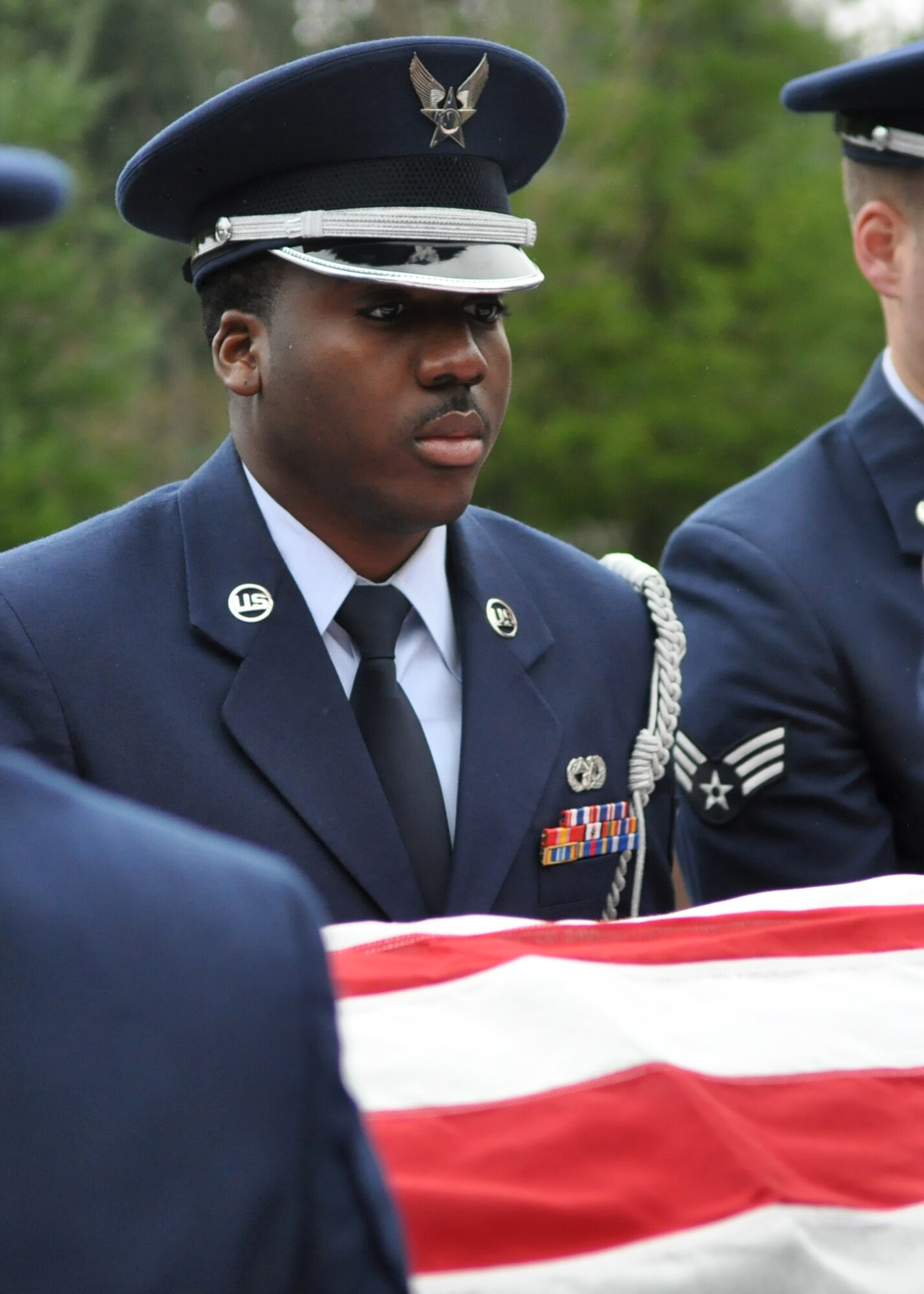 Senior Airman Clifford Browne prepares to move a casket during a funeral Nov. 18, 2011, at Tahoma National Cemetery in Kent, Wash. (U.S. Air Force photo/Airman 1st Class Leah Young)