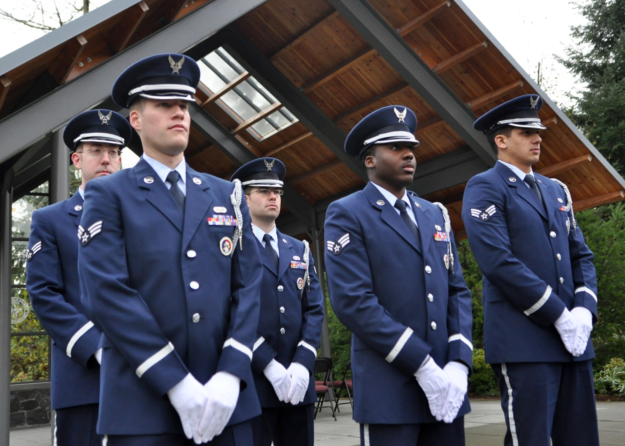 Airmen assigned to the McChord Field Honor Guard prepare to pay respects during a funeral Nov. 18, 2011, at Tahoma National Cemetery in Kent, Wash. At least 48 Airmen are either actively serving or training with the team at all times. (U.S. Air Force photo/Airman 1st Class Leah Young)