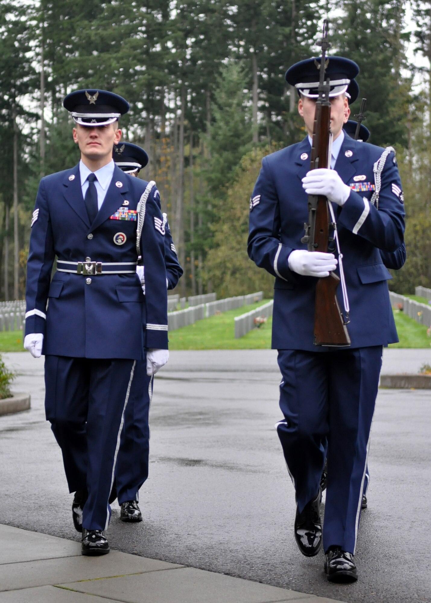 Airmen assigned to the McChord Field Honor Guard prepare to pay respects during a funeral Nov. 18, 2011, at Tahoma National Cemetery in Kent, Wash. The Honor Guard consists of 72 Airmen and has supported almost 700 funerals in 2011. (U.S. Air Force photo/Airman 1st Class Leah Young)