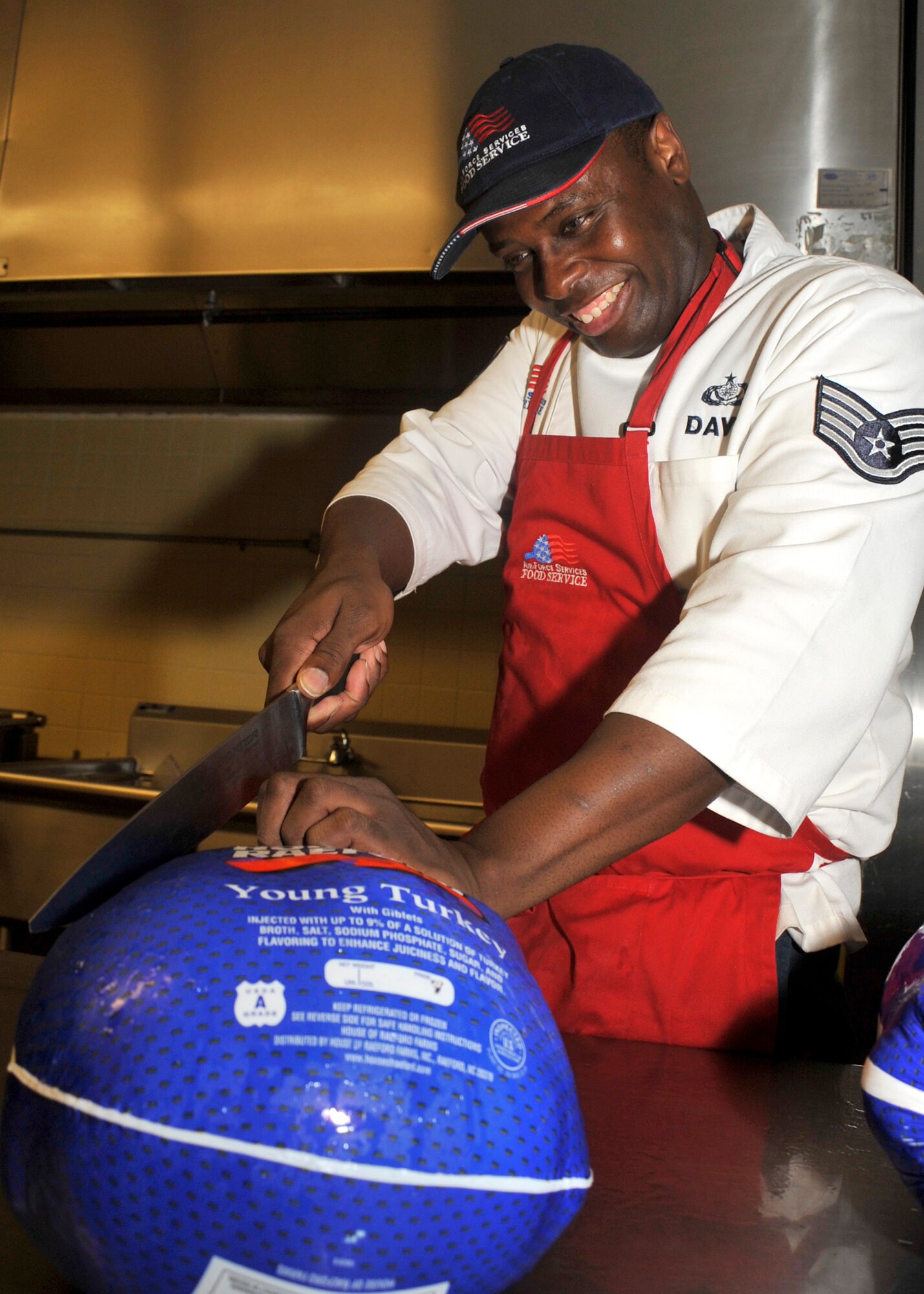 Staff Sgt. Martin Davis prepares to unpack a frozen turkey Nov. 21, 2011, at the Patterson Dining Facility, Dover Air Force Base, Del. Proper safety is important to preparing a safe and healthy Thanksgiving dinner. (U.S. Air Force photo by Tech. Sgt. Chuck Walker)
