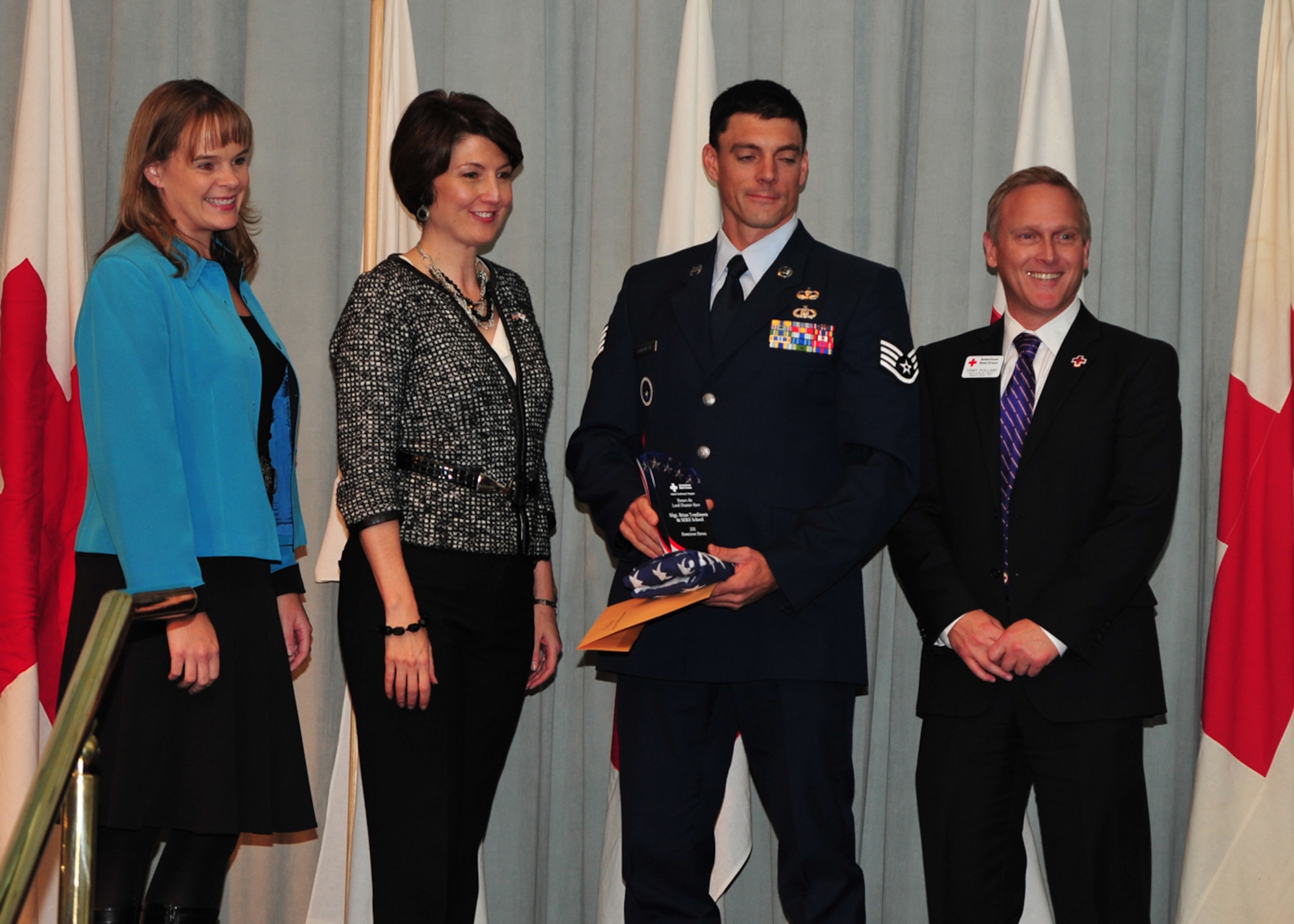 Staff Sgt. Brian Tomlinson, 66th Training Squadron Survival Evasion Resistance Escape School instructor, was given the 2011 local Disaster Heroes Award Nov. 10 after he decided to have him and forty SERE students help protect local families from an impending disaster. (U.S. Air Force photo/Staff Sgt. Michael Means)