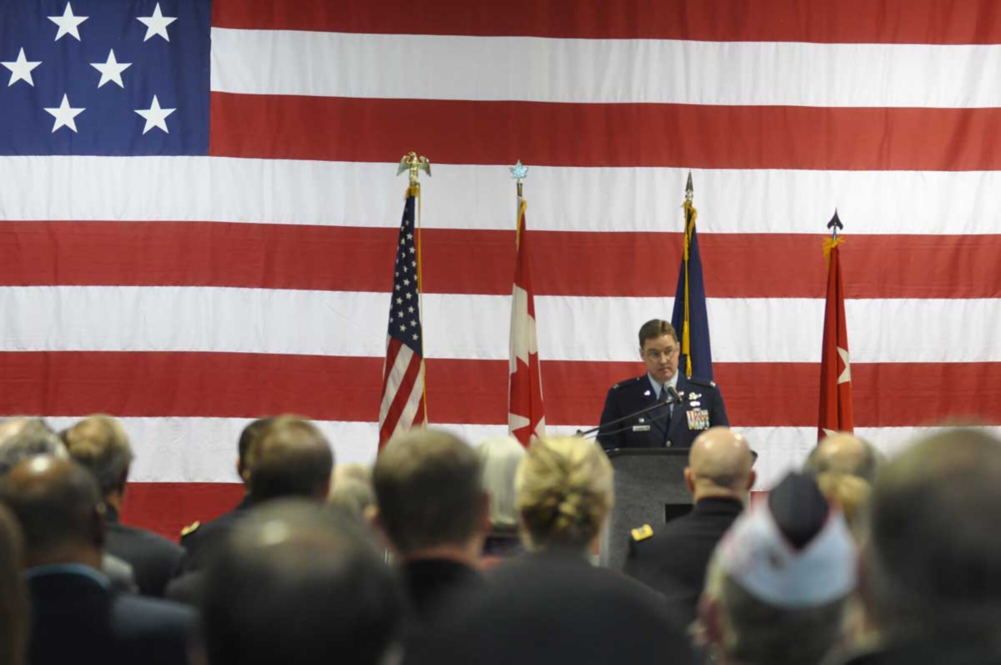 Air Force Col. Rob Evans, Joint Base Elmendorf-Richardson/673d Air Base Wing commander, speaks during Veterans and Remembrance Day at the Alaska National Guard Armory, Nov. 11. (U.S. Air Force photo/Senior Airman Cynthia Spalding)