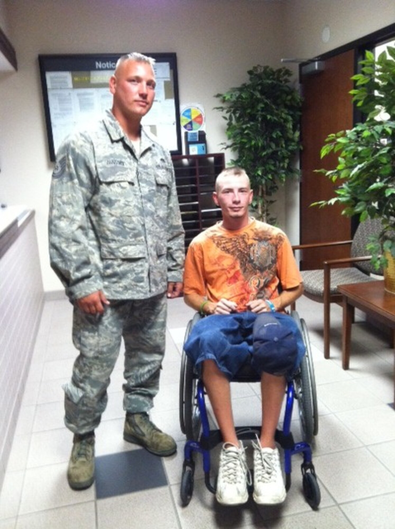 Tech. Sgt. Joel Janssen, 931st AMXS, and Danny Johnson pose for a photograph in August. Johnson visited Janssen at McConnell Air Force Base to thank him for assisting him after his lawn mower stalled in a field in Rose Hill, Kansas. (Courtesy photo)