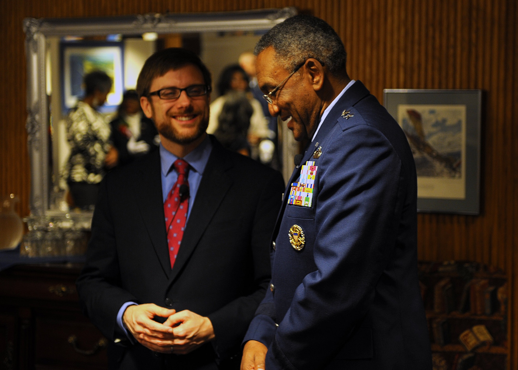 Assistant Secretary of the Air Force for Financial Management and Comptroller Dr. Jamie M. Morin shares a few words with Maj. Gen. Alfred K. Flowers before his retirement ceremony Nov. 17, 2011, at Joint Base Anacostia-Bolling, Washington D.C. Flowers has served more than 46 years on active duty and is the longest serving Airman in Air Force history. Flowers is the deputy assistant secretary for budget. (U.S. Air Force photo/Master Sergeant Raheem Moore)