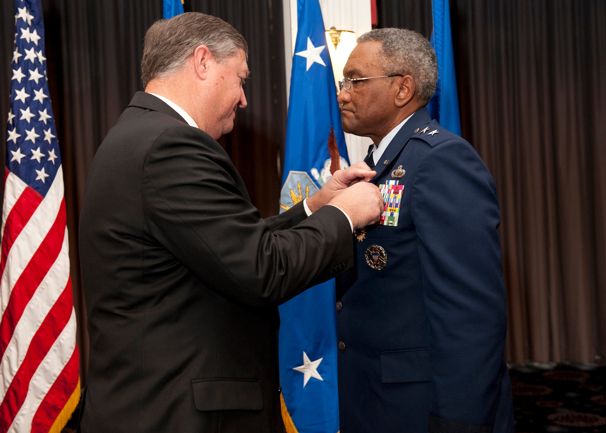 Secretary of the Air Force Michael B. Donley presents Maj. Gen. Alfred K. Flowers the Distinguished Service Medal during the general’s retirement ceremony Nov. 17, 2011, at Joint Base Anacostia-Bolling, in Washington D.C. Flowers has served more than 46 years on active duty and is the longest serving Airman in Air Force history. Flowers is the deputy assistant secretary for budget.(U.S. Air Force photo/Jim Varhegyi)