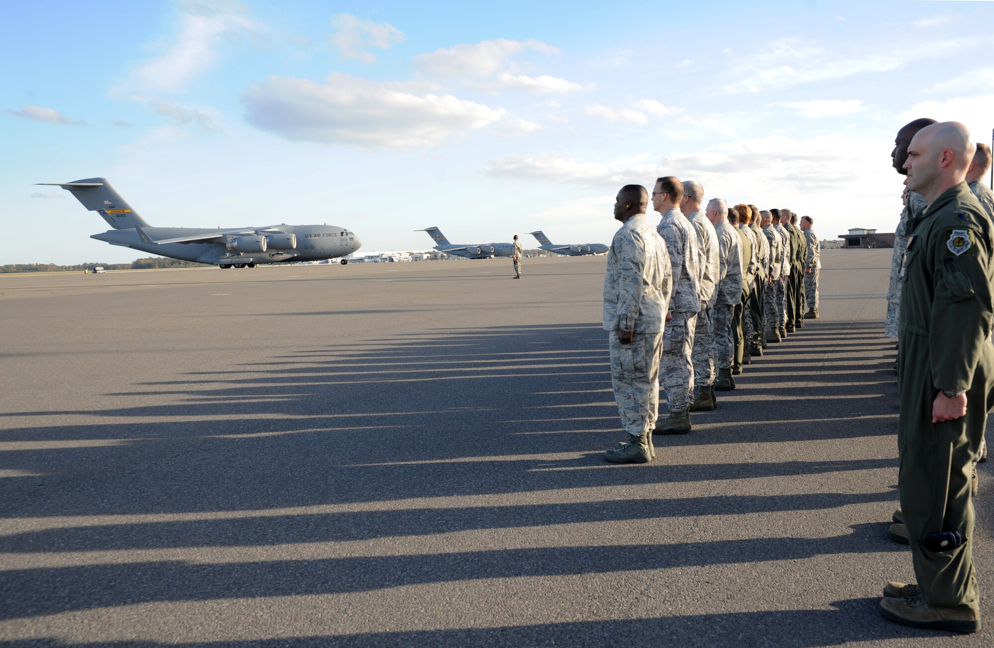 Leadership from Joint Base Charleston welcomes the P-213 Delivery of the C-17 assigned to the 437th Airlift Wing Nov.9. The aircraft was flown by Brig. Gen.Steven Arquiette, Inspector General, Headquarters Air Mobility Command, Scott Air Force Base, Ill. Accompanying Arquiette was Capt. Ryan Herman, 437th ALW instructor pilot, aircraft commander. (U.S.Air Force photo by Airman First Class Ashlee Galloway)