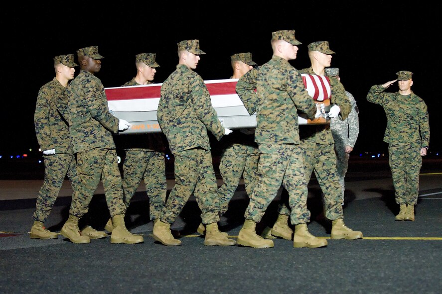 A U.S. Marine Corps carry team transfers the remains of Marine Lance Cpl. Joshua D. Corral of Danville, Calif., at Dover Air Force Base, Del., Nov. 20, 2011. Corral was assigned to 3rd Battalion, 7th Marine Regiment, 1st Marine Division, I Marine Expeditionary Force, Twentynine Palms, Calif. (U.S. Air Force photo/Adrian R. Rowan)