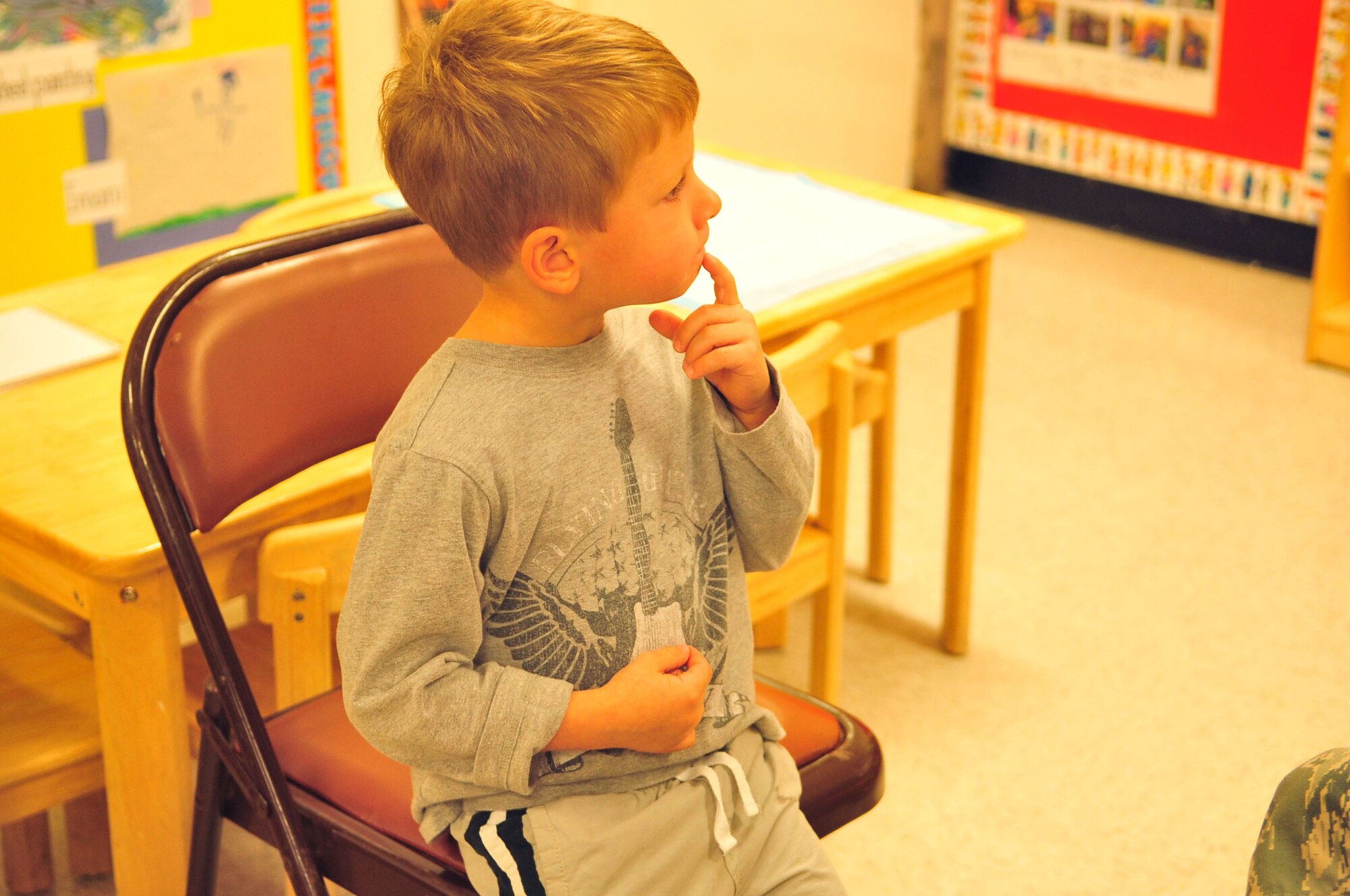 Kellen Graham, ponders about receiving his FluMist vaccine at the Child Development Center at Seymour Johnson Air Force Base, N.C., Nov. 17, 2011. Each year, the FluMist and flu shots are available for all active duty members, reservist and dependents at the 4th Medical Group. Kellen, 3, is the son of Maj. Nick Graham, 4th Operations Support Squadron air defense officer. (U.S. Air Force photo by Senior Airman Marissa Tucker)