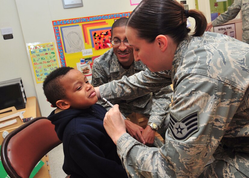 Korbyn Mitchell prepares for the FluMist vaccine from Staff Sgt. Vanessa Dale at the Child Development Center at Seymour Johnson Air Force Base, N.C., Nov. 17, 2011. The FluMist, a relatively new flu vaccine, is administered through the nostrils and is designed to build antibodies in the nose, where majority of flu cases are contracted. Korbyn is the son of Staff Sgt. Derek Mitchell, 4th Component Maintenance Squadron unit safety manager and motorcycle safety course instructor and Dale is a 4th Medical Support Squadron mental health specialist from Newton, N.J. (U.S. Air Force photo by Senior Airman Marissa Tucker)