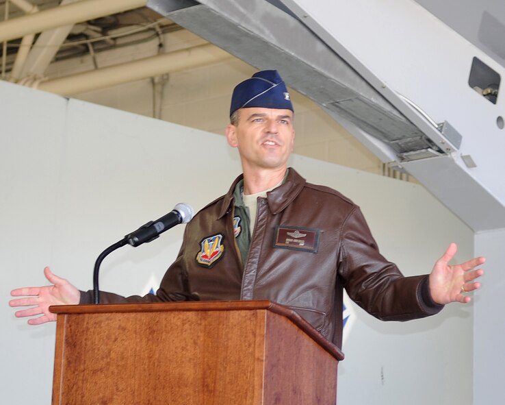 Col. Brian Kirkwood, 4th Operations Group commander, gives a farewell speech to Lt. Col. Jefferson O'Donnell and welcomes Lt. Col. Nicole Malachowski as the new 333rd Fighter Squadron commander during the change of command ceremony at Seymour Johnson Air Force Base, N.C., Nov. 18, 2011. (U.S. Air Force photo by Senior Airman Gino Reyes)