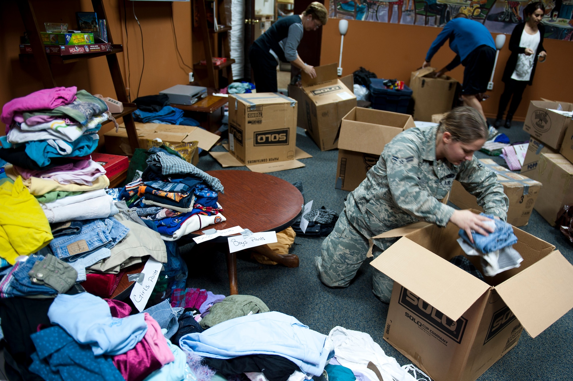 Airman 1st Class Bethany Kerr, 39th Security Forces Squadron, packs supplies for Turkish earthquake victims Nov. 18, 2011, at Incirlik Air Base, Turkey. On Oct. 23, a 7.2-magnitude earthquake occurred near Van, Turkey, killing more than 600 and injuring more than 1,000. The 39th Air Base Wing chapel coordinated the collection of basic hygiene items, winter clothing and footwear donated to the Turkish Red Crescent for those affected. (U.S. Air Force photo by Tech. Sgt. Michael B. Keller/Released)