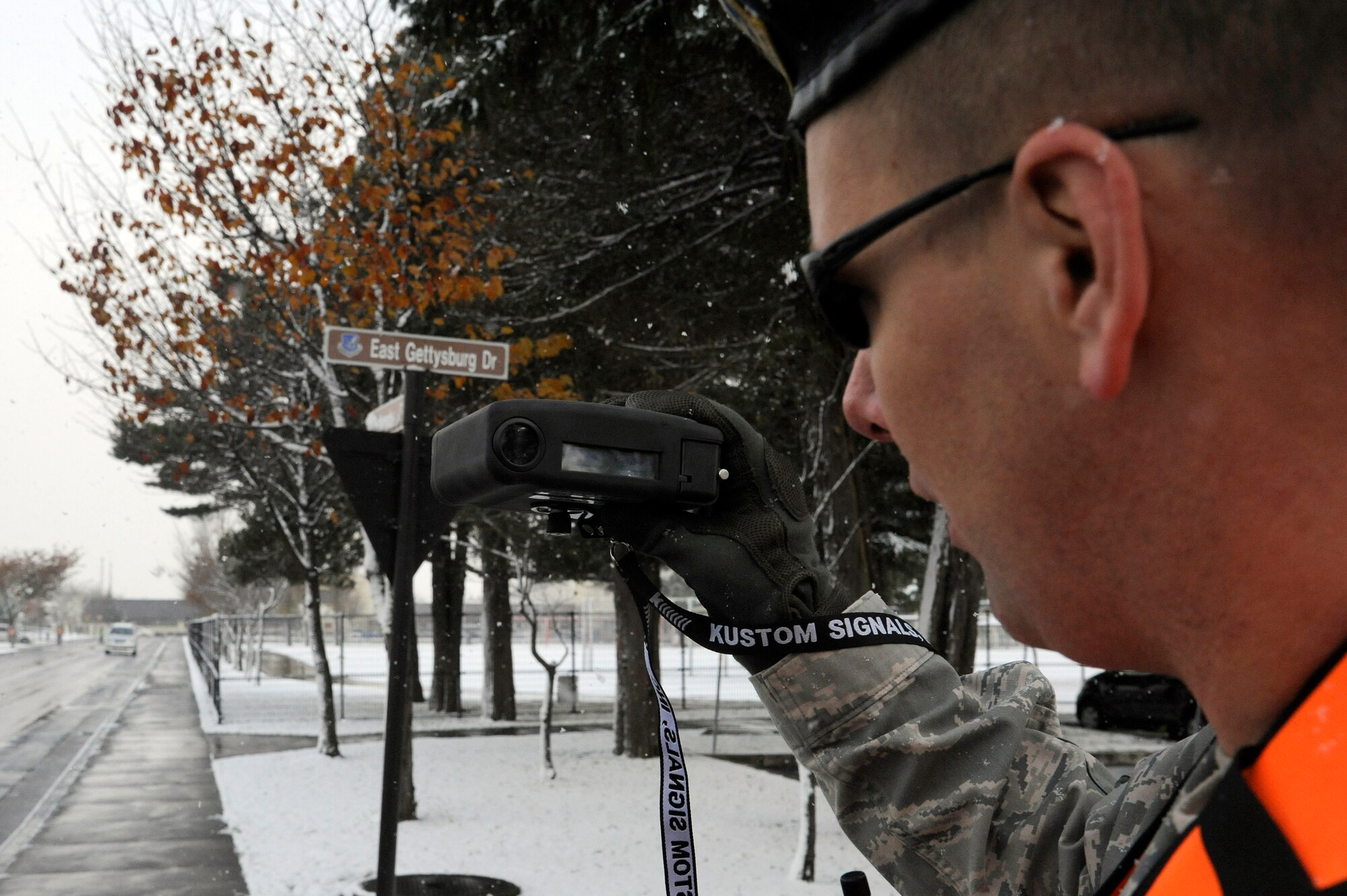 MISAWA AIR BASE, Japan -Tech. Sgt. Eric Parks, 35th Security Forces Squadron, monitors vehicle speeds around Sollars Elementary School here Nov. 21. Wing leadership is stepping up efforts to get people to slow down around the schools and to obey the posted speed limits. Drivers will lose one day of driving privileges for every kilometer over the posted speed limit if caught speeding around the schools or in base housing areas. (U.S. Air Force photo/Tech. Sgt. Marie Brown)