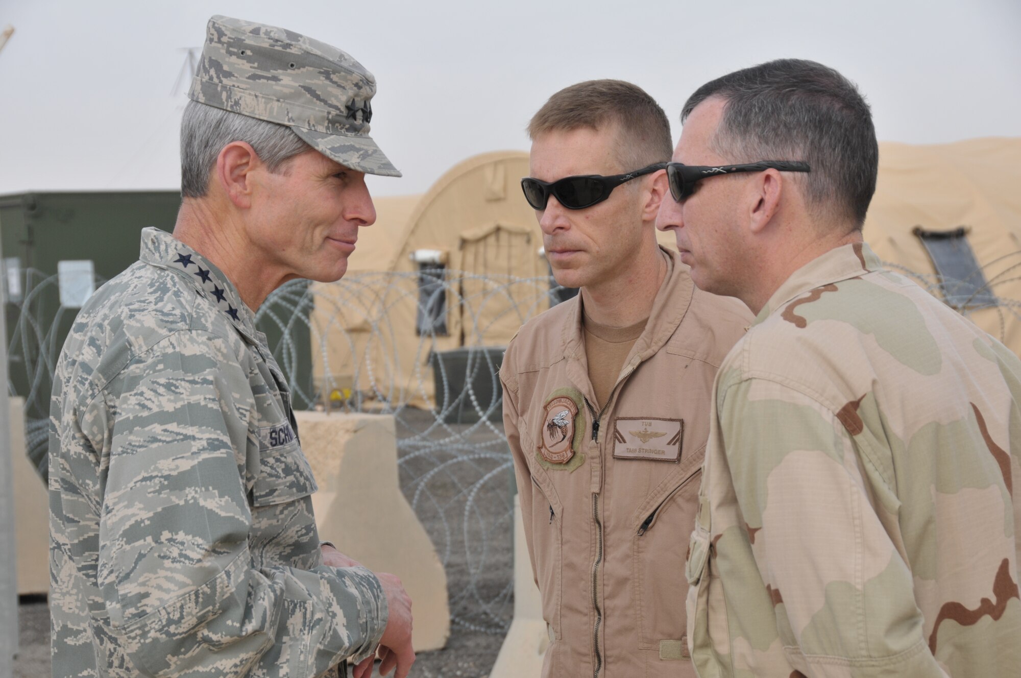 Air Force Chief of Staff Gen. Norton Schwartz visits with Navy Cmdr. Tabb Stringer and Master Chief Petty Officer Sheldon McElhiney, both from Electronic Attack Squadron 138, during his visit to the 332nd Air Expeditionary Wing Nov. 18, 2011. Schwartz talked to the “Yellow Jackets” about their mission and how it plays a key role with providing top cover to U.S. forces transitioning from Iraq. (U.S. Air Force photo by Master Sgt. Paul Mann)