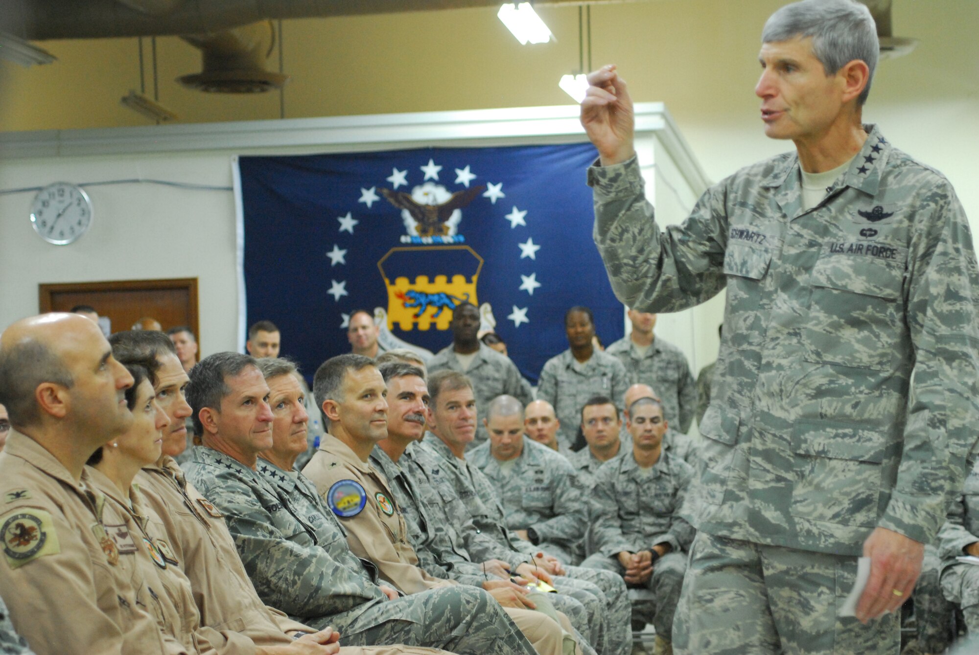 Air Force Chief of Staff Gen. Norton Schwartz addresses Airmen assigned to the 332nd Air Expeditionary Wing Nov. 18, 2011, during an all call at an undisclosed location in Southwest Asia. General Schwartz also answered questions regarding a variety of topics, including current Air Force operations tempo, future deployments and healthcare benefits. (U.S. Air Force photo by 1st Lt. Rusty Ridley)