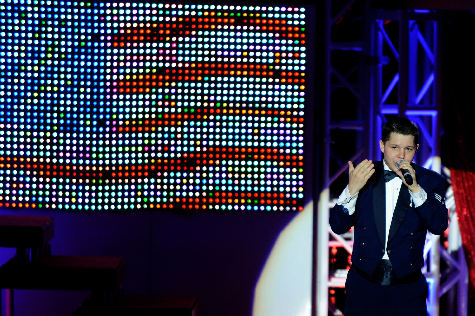 MISAWA AIR BASE, Japan - Senior Airman James Santos, a member of the Tops In Blue 2011 World Tour, sings during a performance at the Misawa Civic Center in Misawa City Nov. 15. The show, entitled "Rhythm Nation," brought to life the music of America, from the early 1900's through today. (U.S. Air Force photo/Tech. Sgt. Marie Brown)