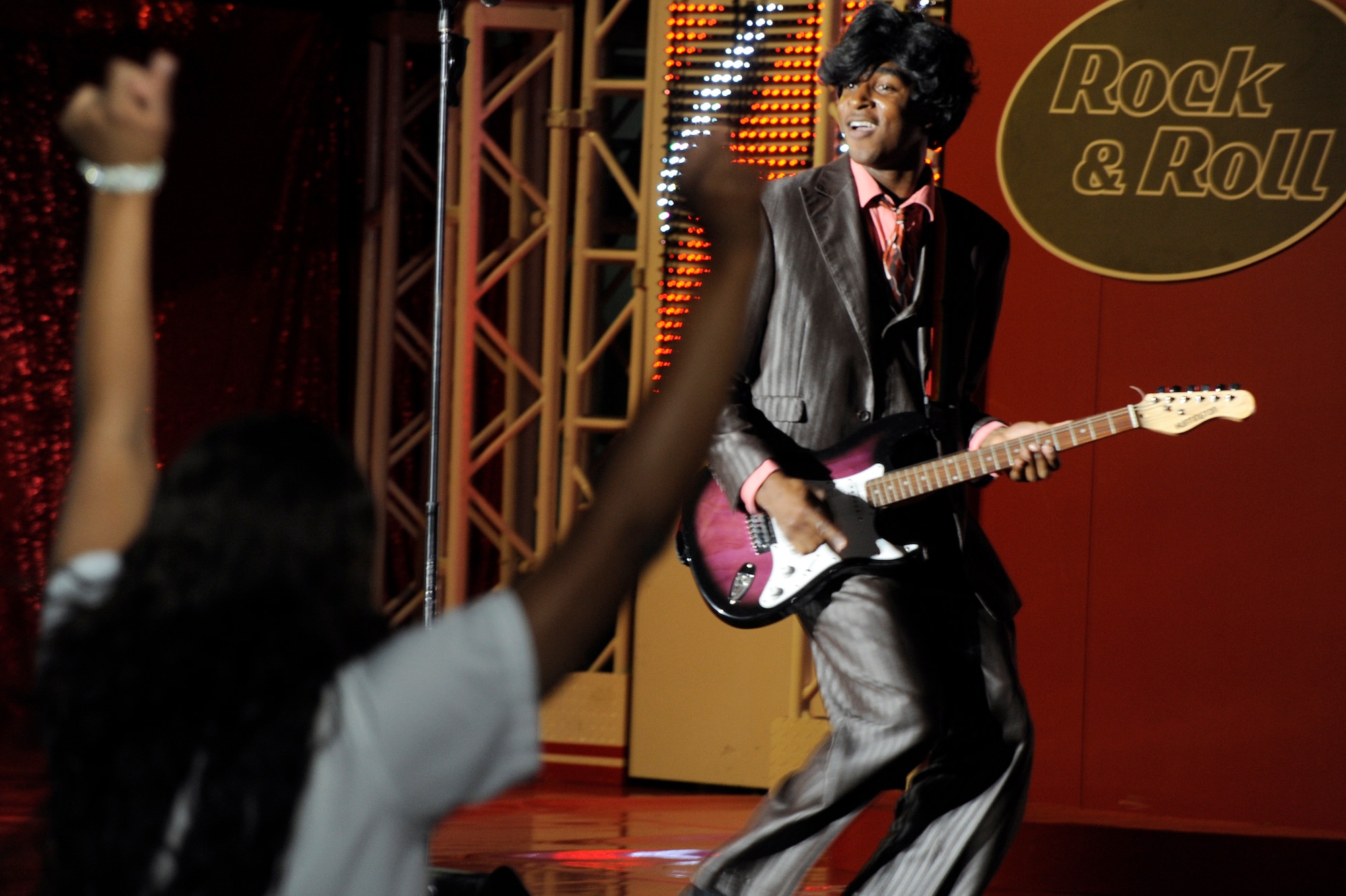 MISAWA AIR BASE, Japan - Airman 1st Class Steve Pearson, a member of the Tops In Blue 2011 World Tour, portrays Little Richard during a performance at the Misawa Civic Center in Misawa City Nov. 15. More than 1,000 Japanese and Americans attended the free show that featured the swinging jazz of Nat King Cole, the great rock and roll sounds of Little Richard, cool Motown Rhythm and Blues of Marvin Gaye, some inspirational country sounds and much more. (U.S. Air Force photo/Tech. Sgt. Marie Brown)