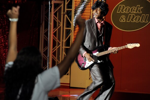 Airman 1st Class Steve Pearson, a member of the Tops In Blue 2011 World Tour, portrays Little Richard during a performance at the Misawa Civic Center in Misawa City near Misawa Air Base, Japan, Nov. 15. More than 1,000 Japanese and Americans attended the free show that featured the swinging jazz of Nat King Cole, the great rock and roll sounds of Little Richard, cool Motown Rhythm and Blues of Marvin Gaye, some inspirational country sounds and much more. (U.S. Air Force photo/Tech. Sgt. Marie Brown) 
