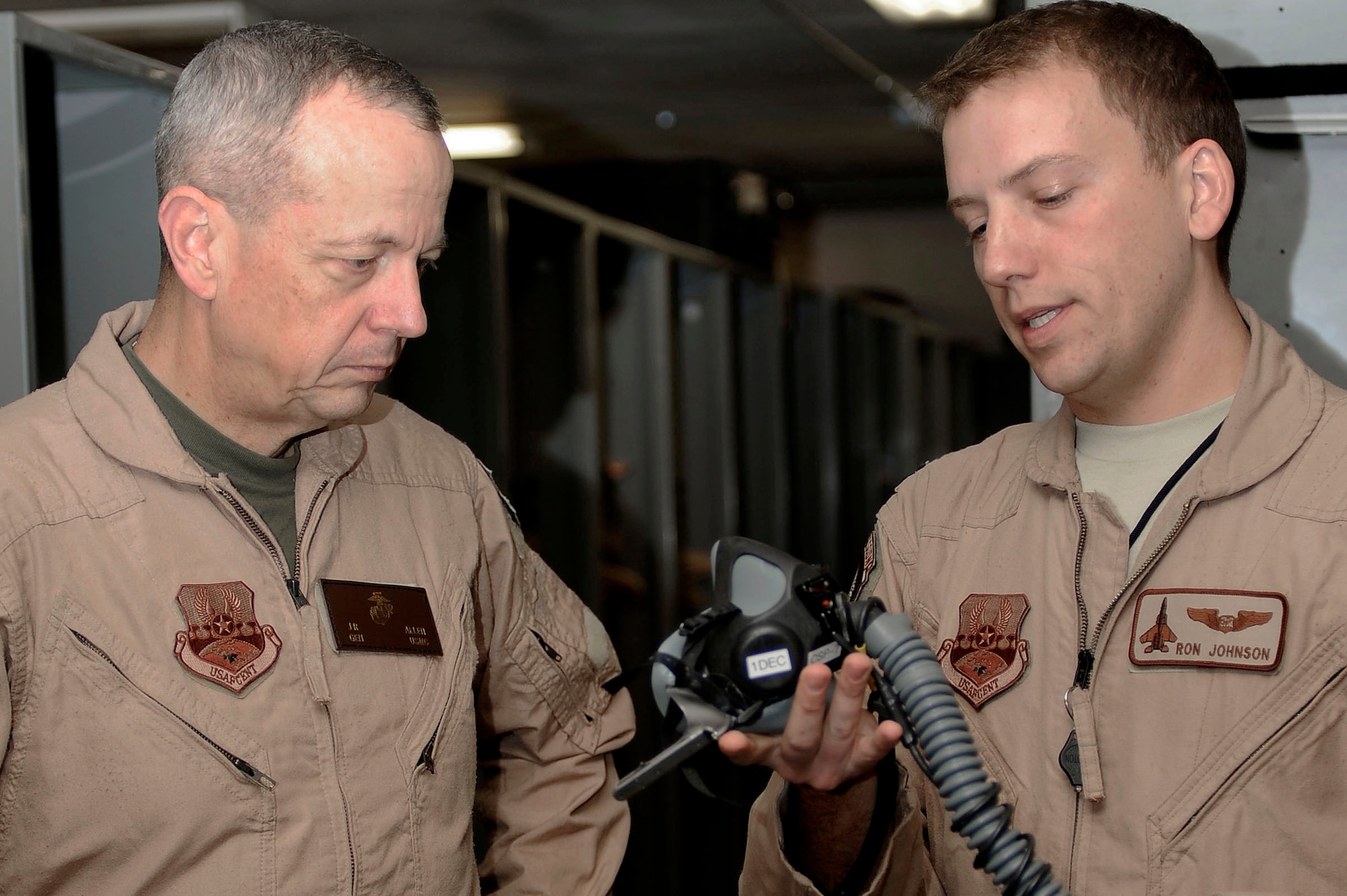 BAGRAM AIRFIELD, Afghanistan – Capt. Ronald Johnson, 335th Expeditionary Fighter Squadron F-15E Strike Eagle pilot (right) talks with ISAF Commander Marine Gen. John Allen (left) prior to his F-15E Strike Eagle orientation flight Nov. 17, 2011, at Bagram Airfield. During General Allen’s flight he experienced close air support firsthand. (U.S. Air Force photo/ Senior Airman Krista Rose)