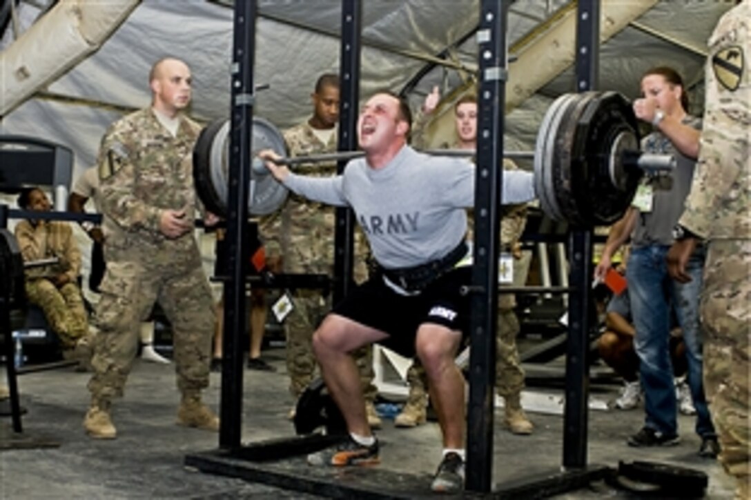 A soldier assigned to the 1st Air Cavalry Brigade takes part in a powerlifting competition on Camp Marmal, Afghanistan, Nov. 20, 2011. The brigade's soldiers organizaed the competition.