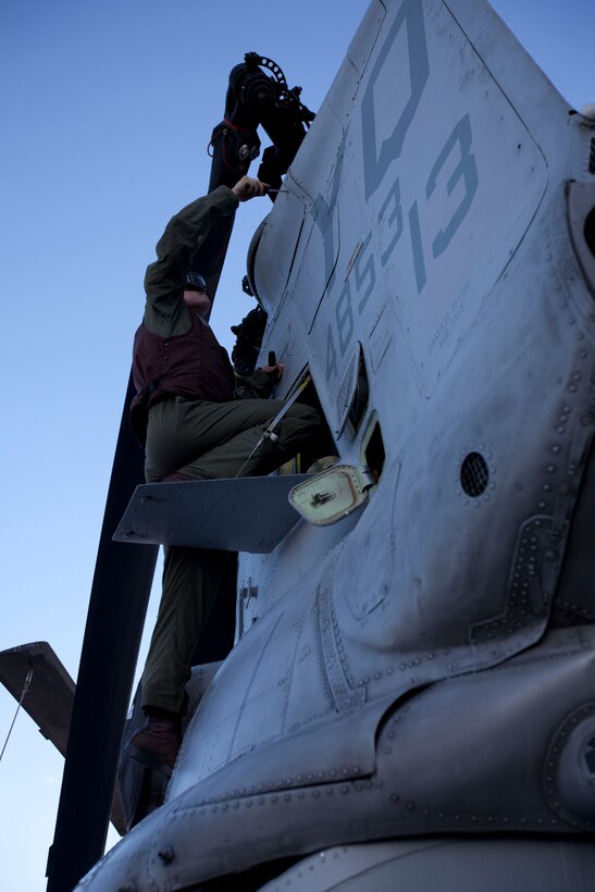 Lance Cpl. Corey Taylor conducts maintenance on a CH-46E Sea Knight aboard USS Makin Island here Nov. 18. Taylor, 20-year-old Houston native, is a crew chief with Marine Medium Helicopter Squadron 268 (Reinforced). The squadron is the aviation combat element for the 11th Marine Expeditionary Unit, which embarked USS Makin Island, USS New Orleans and USS Pearl Harbor in San Diego Nov. 14 beginning a seven-month deployment to the Western Pacific and Middle East regions.