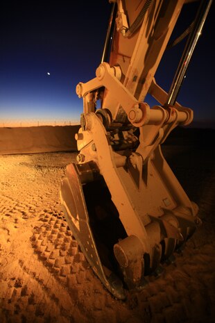 A construction vehicle belonging to Combat Logistics Battalion 1, 2nd Marine Logistics Group (Forward), stands parked aboard Forward Operating Base Geronimo, Afghanistan, in the early morning hours of Nov. 22. The Marines with CLB-1 are currently building Route Victoria in Helmand province. (U.S. Marine Corps photo by Cpl. Katherine M. Solano)