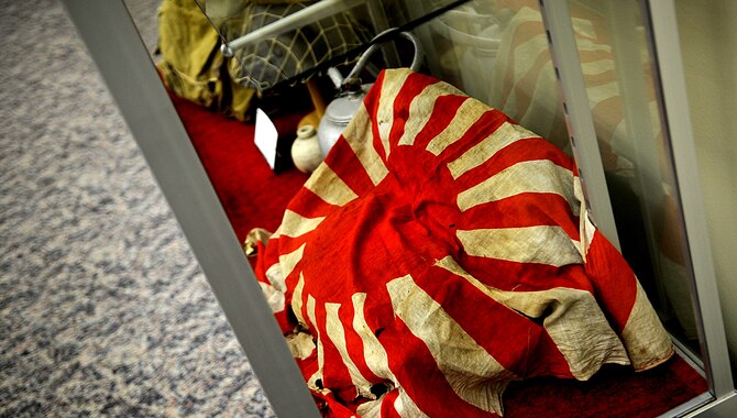 The Japanese Imperial Naval flag was known to U.S. service members as the "Kamikaze" flag - most people didn't know it wan't the national flag. This flag is part of an exhibit that has been located on Camp Kinser since 1994 and has more than 1,000 World War II artifacts on display. (U.S. Air Force photo/Staff Sgt. Christopher Hummel/Released)