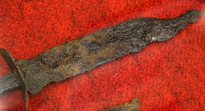 A K-bar knife used by American service members during the Battle of Okinawa. Corrosion affected many items displayed at the Camp Kinser exhibit due to Okinawa's wet weather conditions (U.S. Air Force photo/Staff Sgt. Christopher Hummel/Released) 


