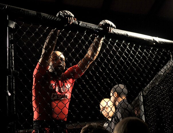 Staff Sgt. Francisco Garrigas, 9th Maintenance Group, mentally prepares for his upcoming Mixed Martial Arts fight at Champions Indoor Soccer Arena in Yuba City, Calif. on Nov. 19, 2011. Fighters take time to plan and focus after they have entered the hexagon ring. (U.S. Air Force photo by Airman 1st Class Samuel W. Sanders/Released)