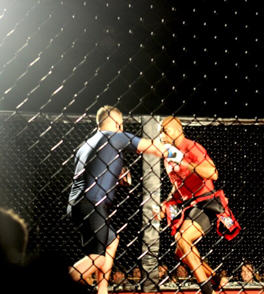 Staff Sgt. Francisco Garrigas, 9th Maintenance Group, takes part in the first Mixed Martial Arts round of Galaxy Fight Night at Champions Indoor Soccer Arena in Yuba City, Calif. on Nov. 19, 2011. Every fight has three rounds that can last up to two minutes each. (U.S. Air Force photo by Airman 1st Class Samuel W. Sanders/Released)