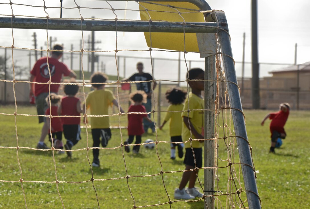 ANDERSEN AIR FORCE BASE, Guam -- Children ages 3-5 play in a soccer game
Nov. 20 here as part of the new 'Sports for Tots' program. The soccer season
began Nov. 8 and will last six-week sessions giving parents time to sign their children up. The next season sport will be baseball then football and cheerleading. There will be roughly a two week break between each season. For more information, e-mail Mrs. Rhine at sportsfortotsaaf@yahoo.com or visit the Sports for Tots Facebook page using the same e-mail address.  (U.S. Air Force photo/Staff Sgt. Alexandre Montes)
