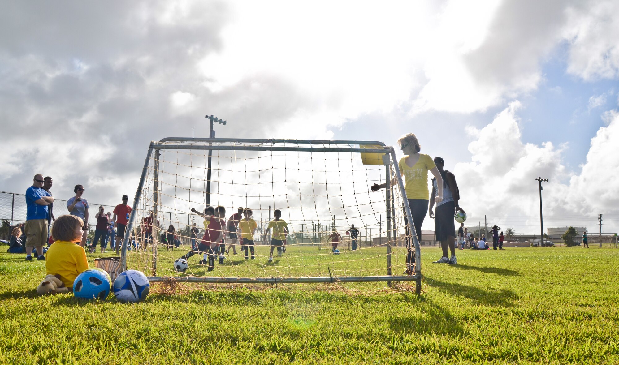 ANDERSEN AIR FORCE BASE, Guam -- Children ages 3-5 play in a soccer game
Nov. 20 here as part of the new 'Sports for Tots' program. The soccer season
began Nov. 8 and will last six-week sessions giving parents time to sign their children up. The next season sport will be baseball then football and cheerleading. There will be roughly a two week break between each season. For more information, e-mail Mrs. Rhine at sportsfortotsaaf@yahoo.com or visit the Sports for Tots Facebook page using the same e-mail address.  (U.S. Air Force photo/Staff Sgt. Alexandre Montes)
