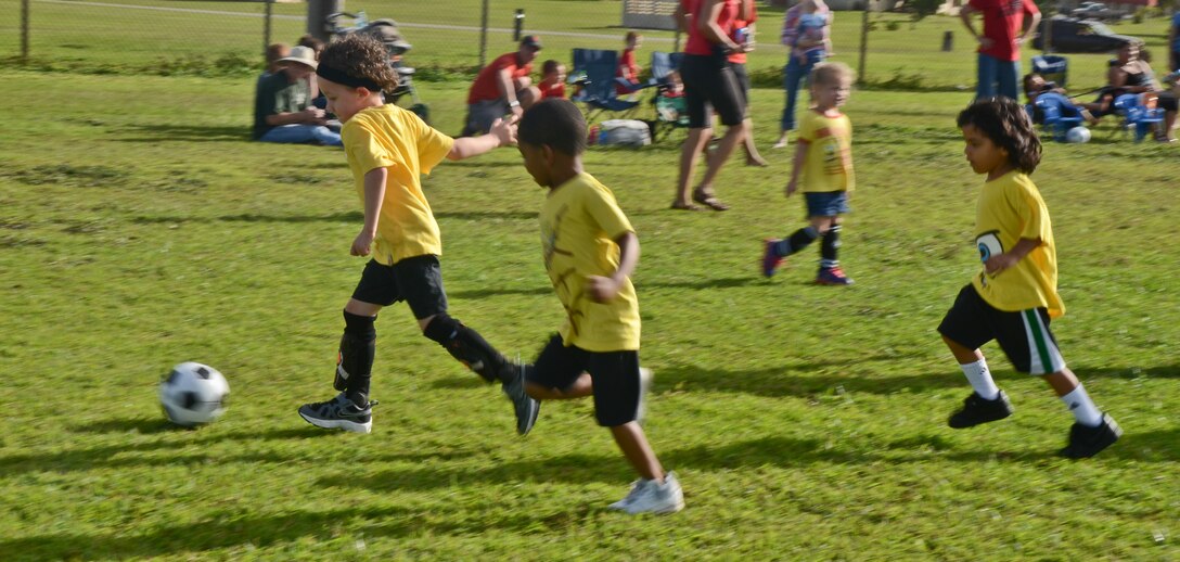 ANDERSEN AIR FORCE BASE, Guam -- Children ages 3-5 play in a soccer game
Nov. 20 here as part of the new 'Sports for Tots' program. The soccer season
began Nov. 8 and will last six-week sessions giving parents time to sign their children up. The next season sport will be baseball then football and cheerleading. There will be roughly a two week break between each season. For more information, e-mail Mrs. Rhine at sportsfortotsaaf@yahoo.com or visit the Sports for Tots Facebook page using the same e-mail address.  (U.S. Air Force photo/Staff Sgt. Alexandre Montes)
