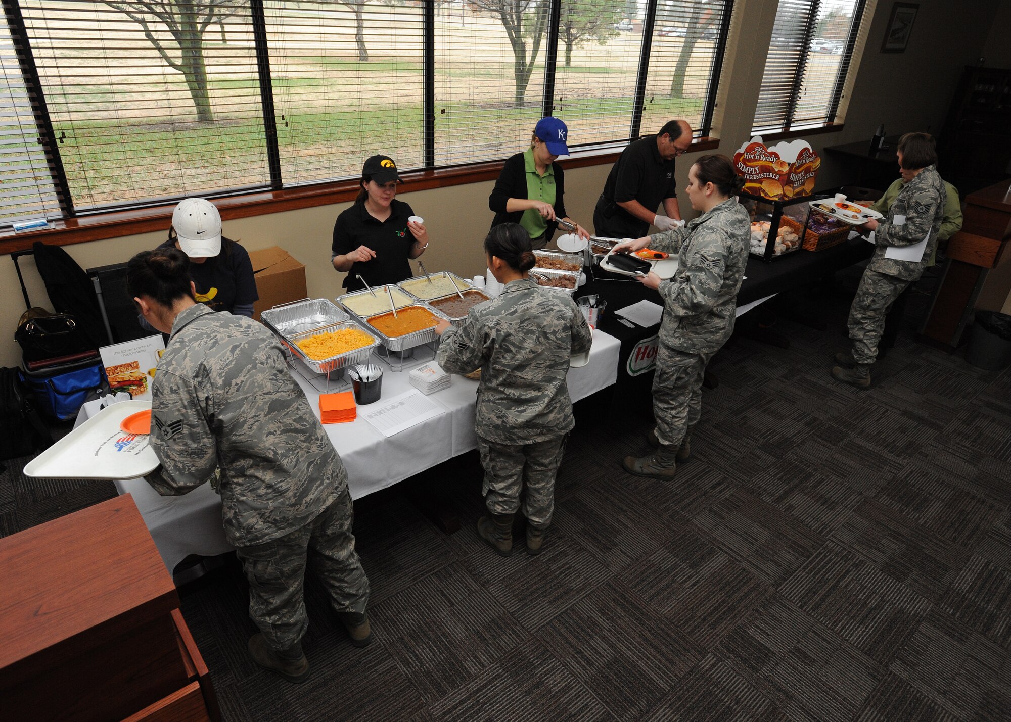 Team McConnell members select food from a variety of vendors during a food show at the Chisholm Trail Inn Dining Facility Nov. 22, 2011, McConnell Air Force Base, Kan.  The food was rated by Airmen to determine new menu options.  (U.S. Air Force photo/ Airman 1st Class Jose L. Leon)