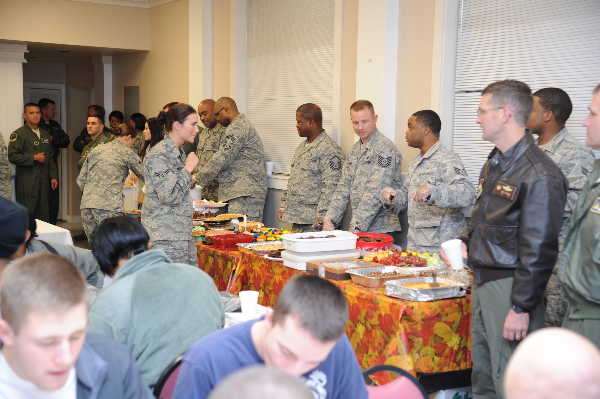 Airman 1st Class Ariel Morgan, 14th Operations Support Squadron looks over a large selection of deserts at the 2011 annual Dormsgiving on Nov. 17 at the Chapel Annex. Dormsgiving is a thanksgiving themed dinner put together by organizations and base leaders for enlisted dormitory residents. (U.S. Air Force photo/Charles Dickens)