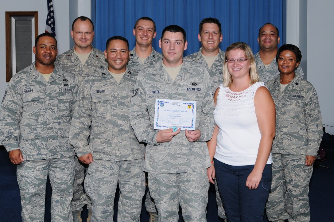 Staff Sgt. Jason Smith, 36th Wing chapel program support non-commissioned
officer in charge, was awarded Andersen's Best here, Nov. 17. Andersen's
Best is a recognition program which highlights a top performer from the 36th
Wing. Each week, supervisors nominate a member of their team for outstanding
performance and the wing commander presents the selected Airman/Civilian
with an award. (U.S. Air Force photo by Senior Airman Carlin Leslie)
