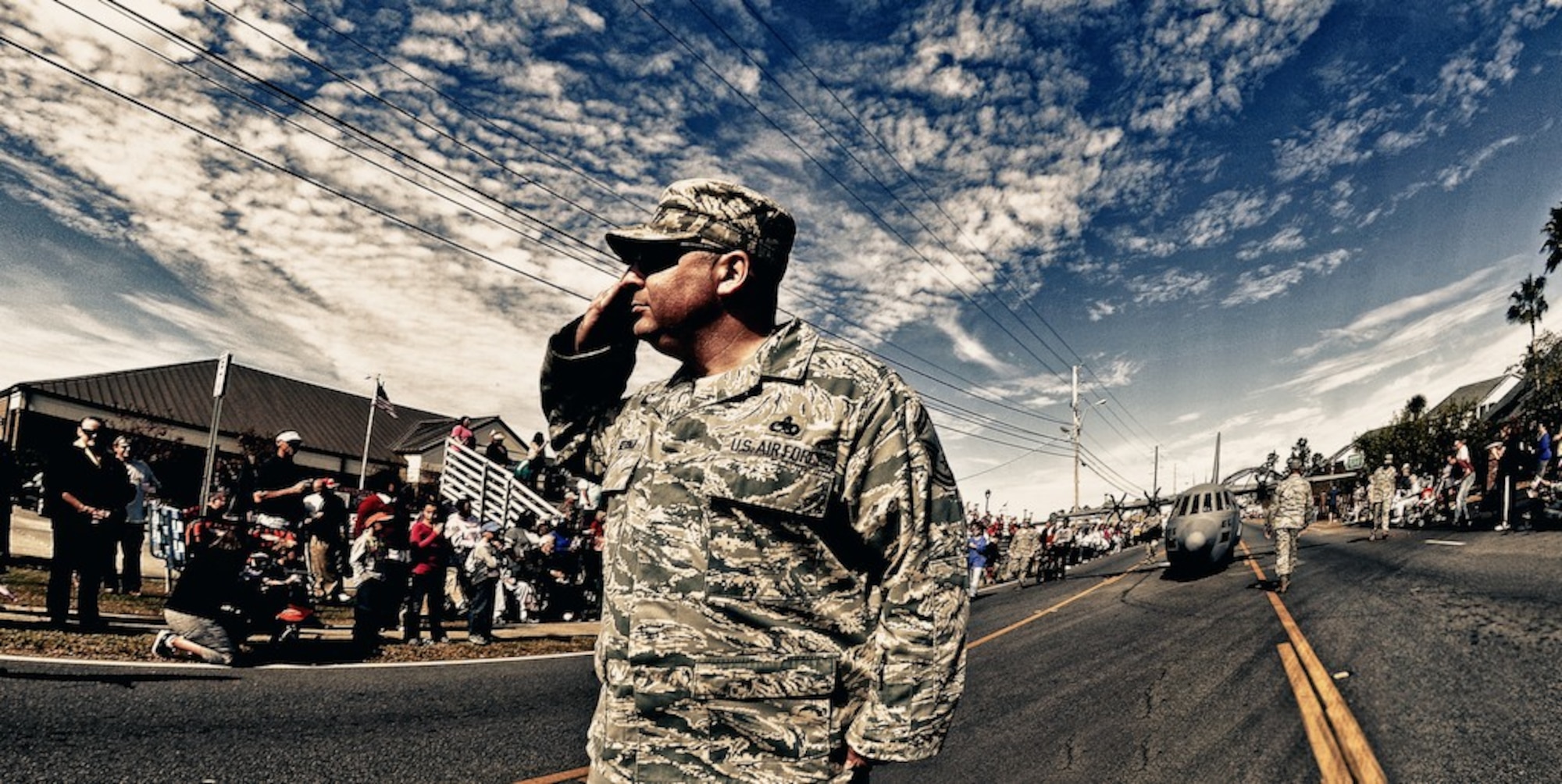 Senior Master Sgt. Neil Sherman, 403rd Wing senior recruiter, salutes officials in the grandstand during the Veterans Day parade in D'Iberville, Miss. Nov. 12. (U.S. Air Force Photo by. Capt. J. Justin Pearce) 